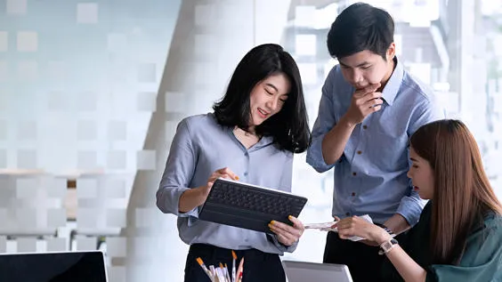 Group of professionals analysing work